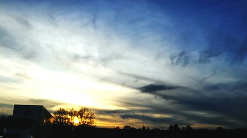 Scenic view of landscape against sky at sunset