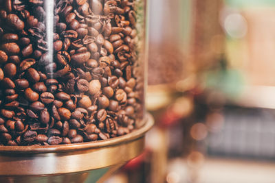 Roasted coffee beans in container at coffee shop