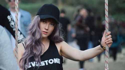 Portrait of young woman wearing hat