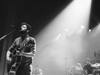 Full length of man playing guitar