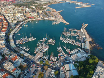 High angle view of sea and buildings in city