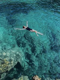 High angle view of person swimming in sea