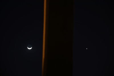 Low angle view of moon against sky at night