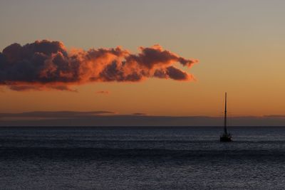 Scenic view of sea against orange sky