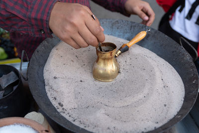 Midsection of man preparing food
