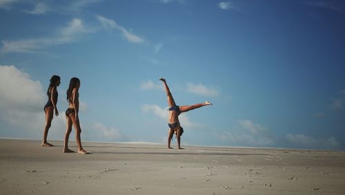 Woman jumping on beach