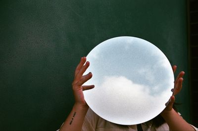 Close-up of hand holding ball