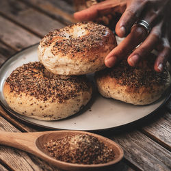 Woman holding baked bread on plate