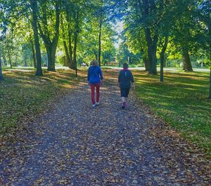 Full length of woman walking on footpath