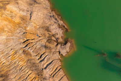 Aerial view of lake by rocky landscape