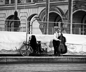 People riding bicycles on street in city