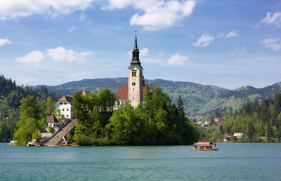 Scenic view of sea and buildings against sky