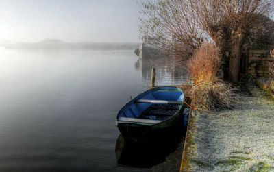 Boat in lake against sky