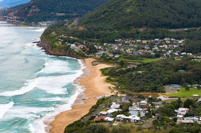 High angle view of buildings by sea