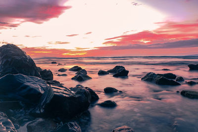 Scenic view of sea against sky at sunset