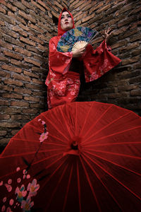 Woman with red umbrella