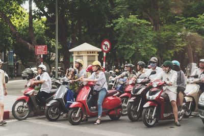 People on street against trees