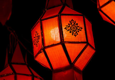 Low angle view of illuminated lantern at night