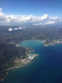 Aerial view of landscape and sea against sky