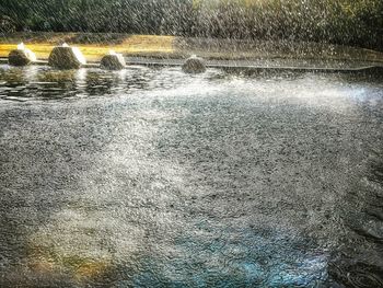 Blurred motion of water splashing on land
