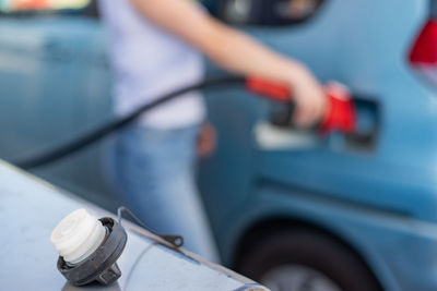 Close-up of person driving car