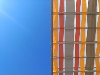 Low angle view of built structure against clear blue sky