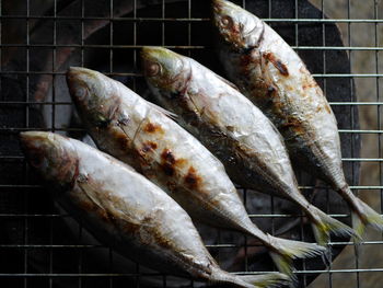 High angle view of dead fish on barbecue