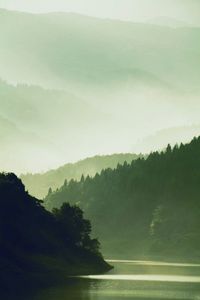 View of calm lake against mountain range