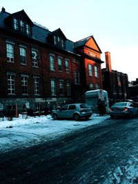 Houses against clear sky during winter