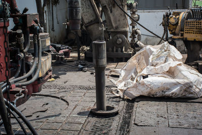 Garbage on footpath by street in city