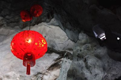 Close-up of red light against wall