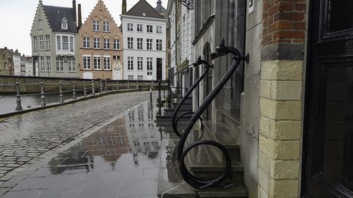 Canal amidst buildings in city