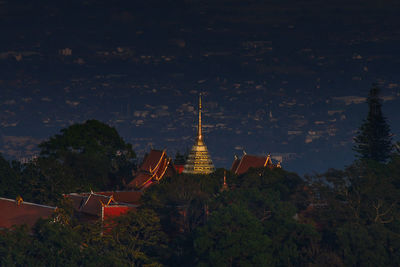 Low angle view of pagoda and buildings against sky