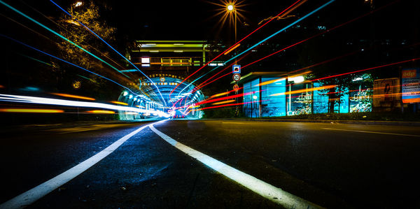 Light trails on road in city at night