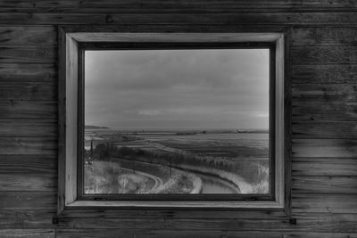 Scenic view of old building seen through window