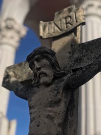 Low angle view of statue against sky