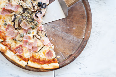 High angle view of pizza in plate on table