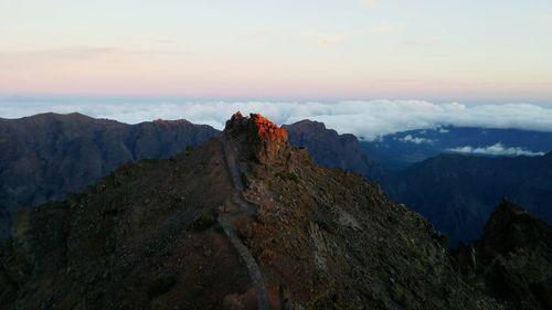 Scenic view of mountains against sky during sunset