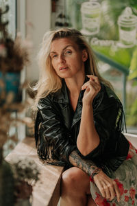 Portrait of young woman sitting at cafe