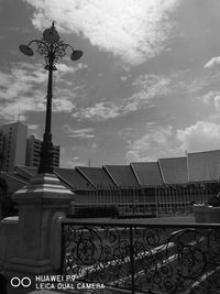 Low angle view of building against cloudy sky