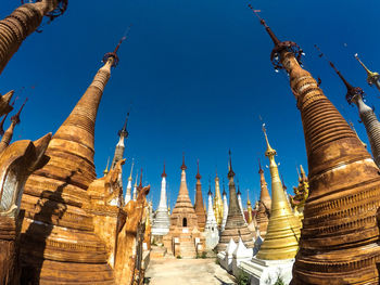 Low angle view of temple against clear blue sky