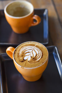 Close-up of cappuccino on table