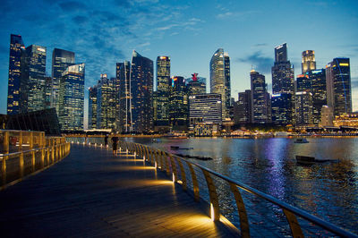 Illuminated city at waterfront