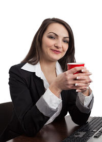 Portrait of a young woman holding coffee cup