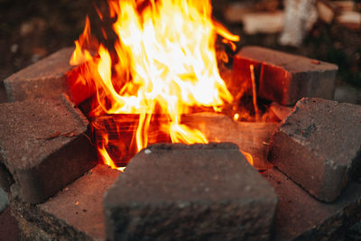 Close-up of burning fire on wood