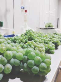 Close-up of grapes in plate on table