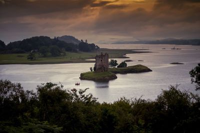 Scenic view of sea against cloudy sky