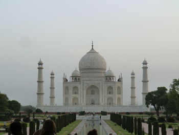 Facade of historic taj mahal building against clear sky