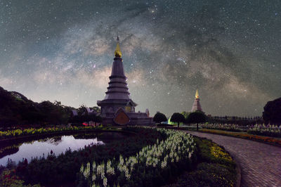 The milky way galaxy moving over a sacred temple at doi inthanon chiang mai, thailand. 