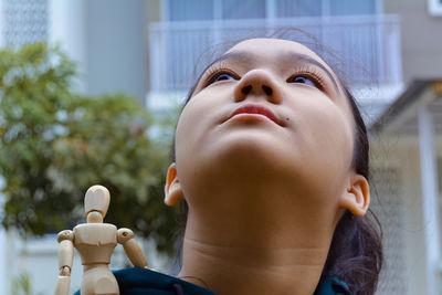 Close-up portrait of boy looking up